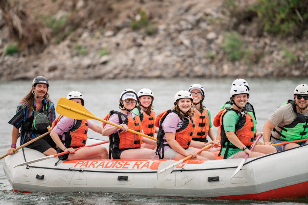 kids having fun rafting on a river